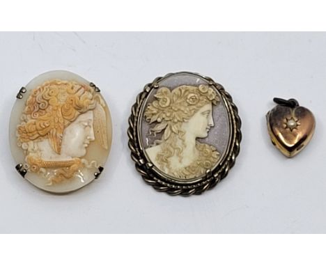 A white metal mounted carved oval shell cameo pendant/brooch, depicting a profile bust of Medusa, height 42mm, together with 