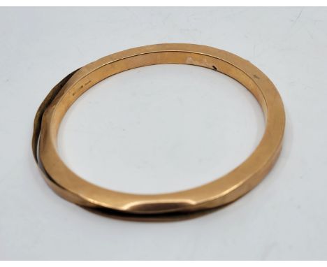 A 15ct. rose gold bangle, outer diameter 80mm (as found). (17.4g)