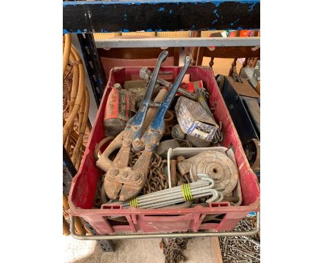 Shelf of tools to include a car jack, grinding discs, metal props, chain, cutters etc