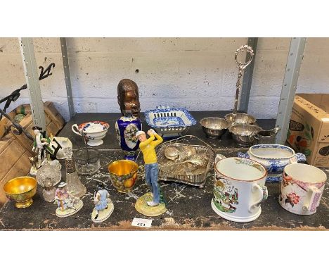 Shelf to include drinking vessels, Royal Doulton "Teeing Off" ornament, wooden carved head etc