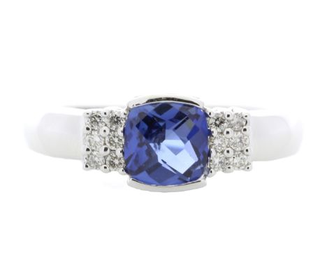 A square rose cut created ceylon sapphire sits between twelve round brilliant cut diamonds in this gorgeous 9ct white gold ri