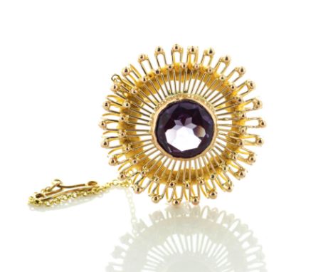 A beautiful vintage pre-owned brooch with a stunning round brilliant cut amethyst weighing 3.70 carats in a rub over centre s