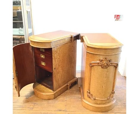 A pair of Victorian satinwood birch pedestals, the bow fronted tops with inset mahogany panel above a relief carved applied s