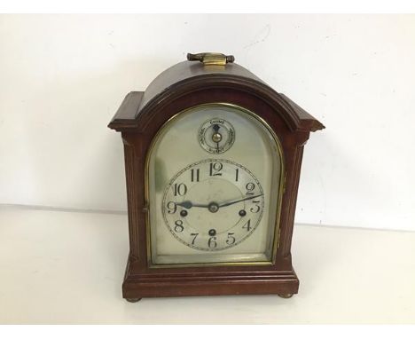 A 1930s/40s mantel clock, with domed top above a metal dial, on bun feet (a/f) (27cm x 15cm x 22cm)