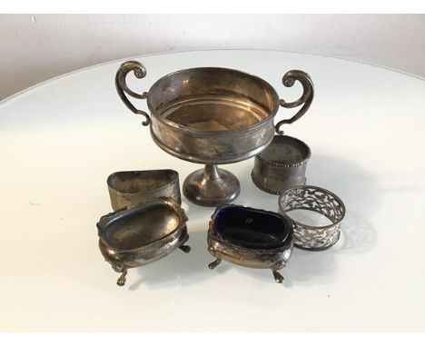 An Edwardian London silver miniature two handled trophy, a Chester silver salt and a Birmingham silver salt, a Sheffield silv