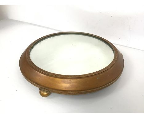 A Victorian circular stand, with mirror top within Greek key decorated frame, on bun feet and mahogany base, inscribed Awarde