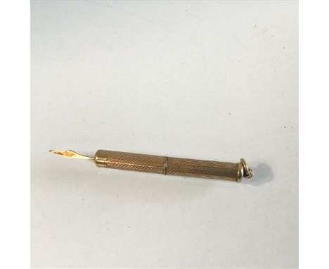 An Edwardian 9ct gold engine turned decorated toothpick (l.5cm) (6.35g)