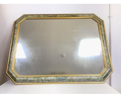 A modern wall mirror with gilt and foliate painted moulded frame (73cm x 93cm)