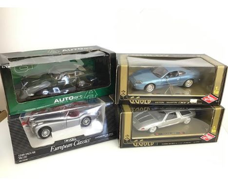 A collection of diecast cars including a Guiloy, Aston Martin and Mercedes, and an ERTL Jaguar and an AUTOart Aston Martin, a