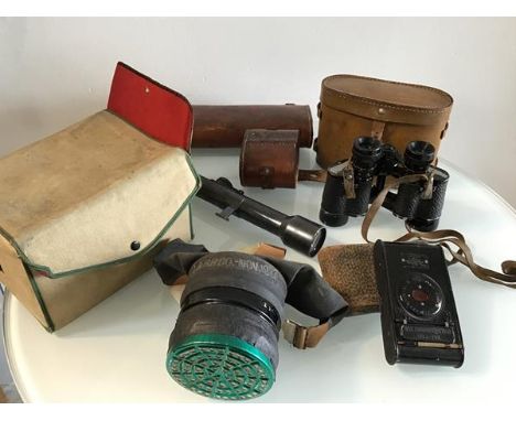 A WWI gun sight, made by Zielvier, no 505A2 complete with original leather case, a pair of WWII field glasses, numbers remove