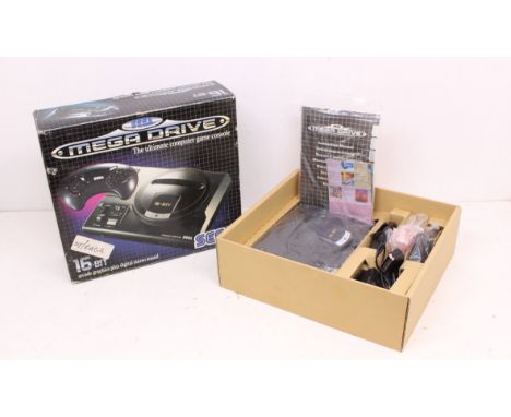 Sega: A boxed Sega Mega Drive console, complete with instruction manual, power cable, one official Sega controller and one Qu