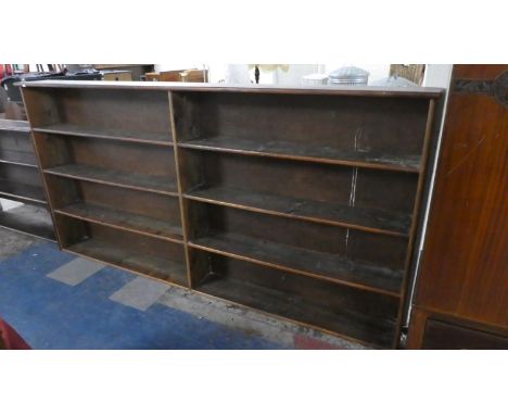 An Edwardian Stained Pine Two Division Four Shelf Open Bookcase, 247cm Wide 