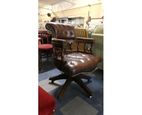 A Mid 20th Century Button Leather Upholstered Swivel Office Armchair 