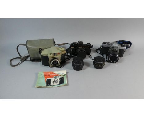 A Pentax K1000 35mm Camera, Two Pentax Lenses, Praktica BMS Electronic 35mm Camera and a Cased Brownie 