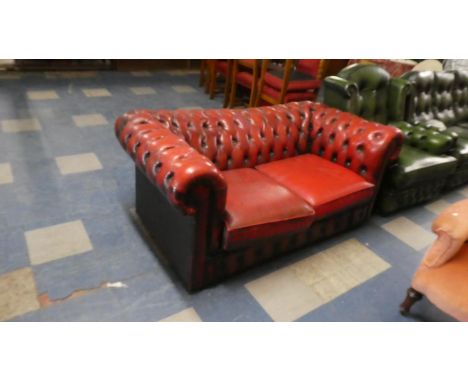 A Red Leather Two Seater Button Upholstered Chesterfield Settee, 160cm Wide 