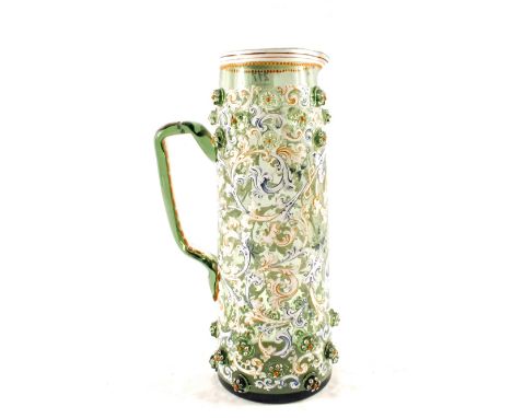 A 19th Century green Bohemian glass jug with enamel leaf decoration and applied roundels