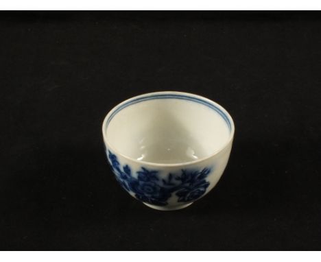 A small Royal Worcester blue and white tea bowl with floral and insect decoration
