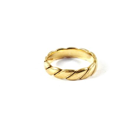 An 18ct Gold wedding band, size K