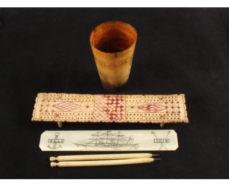 A 19th Century horn beaker scrimmed 'John Mills' sailing ship, a bone cribbage board N.C.1815, a bone ruler and two Ivory pen