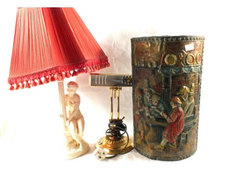 A Brass embossed stick stand, students lamp and a plaster seated lady lamp