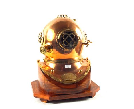 A modern Copper and Brass Navy diving helmet, mark V, Mod-1 on wooden base