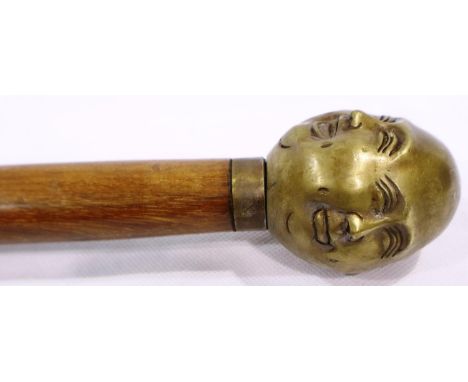 Brass four faced Buddha handled walking stick, L: 94 cm. P&amp;P Group 3 (£25+VAT for the first lot and £5+VAT for subsequent