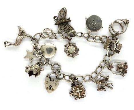 925 silver charm bracelet with hallmarked silver padlock clasp and twelve charms, chain L: 18 cm. P&amp;P Group 1 (£14+VAT fo