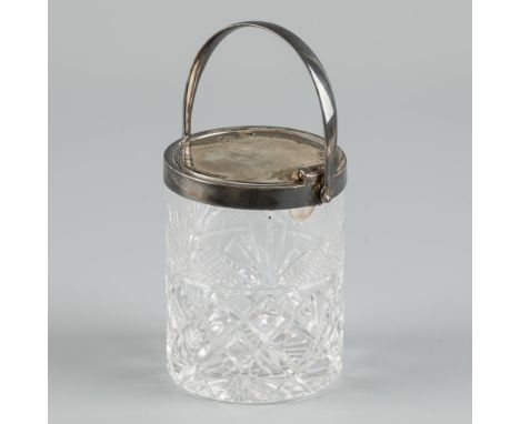 Made of crystal-cut glass with silver fittings, lid and handle. Lid fitted with spoon holder, opens by pulling down the handl