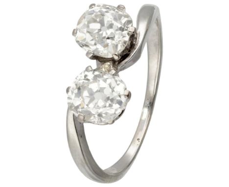 Hallmarks: 750. Set with 2 old mine cut diamonds of approx. 1.07 ct. (clarity: P, color: K-L, small chip on girdle) and appro