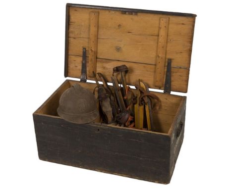 A lot comprisig a.o. an army chest, a fireman's helmet and a pair of Frisian "doorlopers" traditional iceskates.