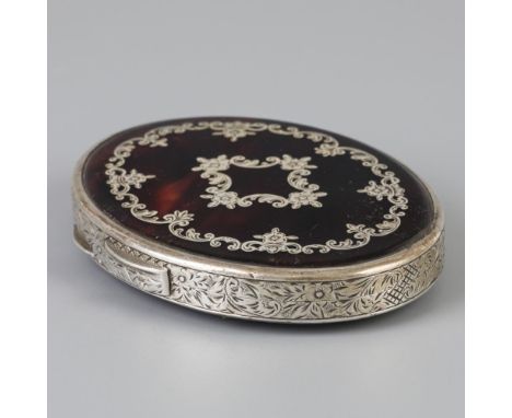 Oval model with silver inlaid tortoiseshell and with engraved floral decorations. With mirror inside. Early 20th century, hal
