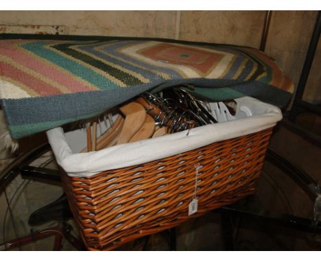 A Kilim rug, wicker hamper, wooden coat hangers, etc.