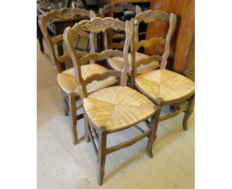 A set of 4 French oak ladder back dining chairs.
