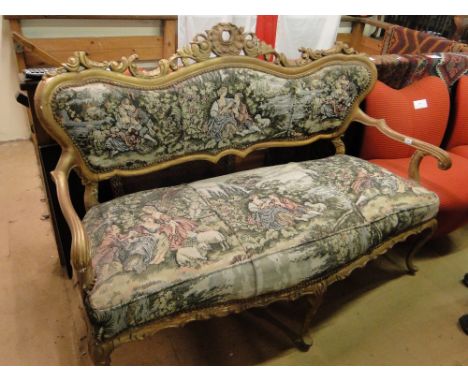 A continental carved giltwood framed salon sofa.