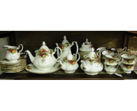 An extensive Royal Albert "Old Country Roses" tea service including 3 teapots, a coffee pot, jugs and sugar bowl.