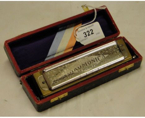 A cased Super chromonica chromatic harmonica by M Hohner.