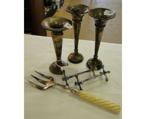 3 Silver bud vases, pair of knife rests and an ivory handled bread fork.