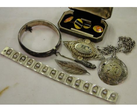 A 1970s silver panel set bracelet, engraved silver bangle, continental silver pendant and chain, brooches, and a cased pair o