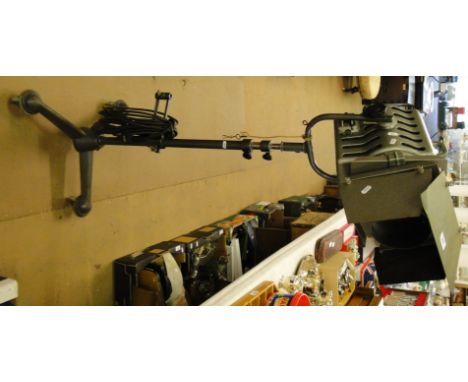 A floor standing stage floodlight lamp on adjustable tripod stand with castors.
