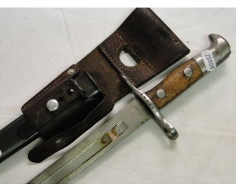 A German bayonet in scabbard.