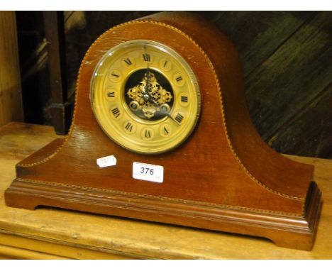 A walnut cased inlaid clock with brass dial and 2-train movement.