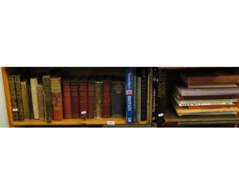 A shelf of books including Dickens and Fairy Stories.