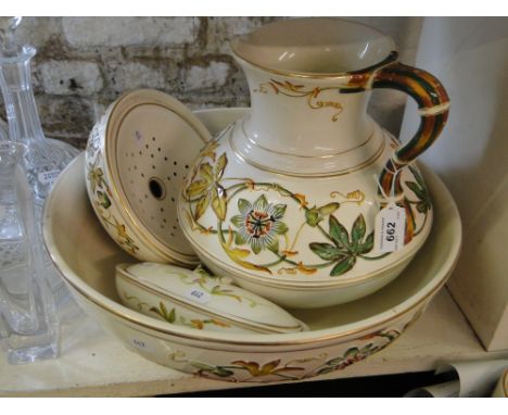 A Victorian Davenport wash jug, basin, soap dish and tooth brush holder with embossed and painted stylised floral decoration.