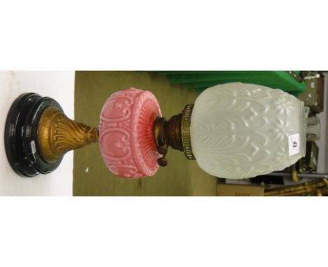 Antique oil lamp with pink milk glass font, and shade and chimney.