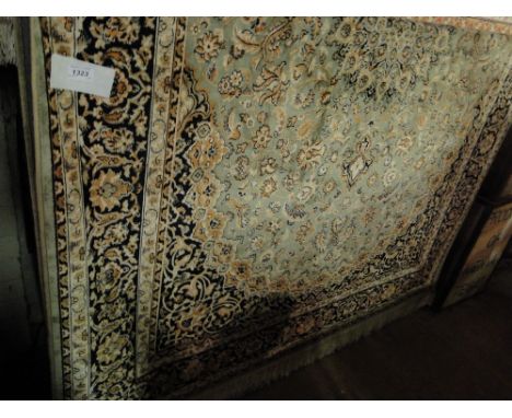 A Green ground Keshan carpet. 2.3 x 1.6 m