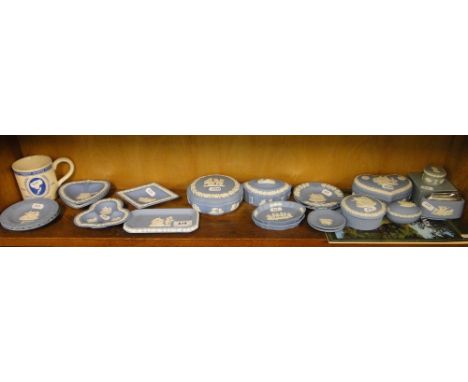 A shelf of Wedgwood blue Jasperware boxes and dishes, etc.