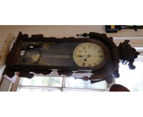 A walnut cased regulator wall clock.
