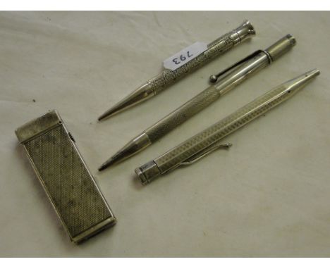3 Silver propelling pencils and a Dunhill lighter.