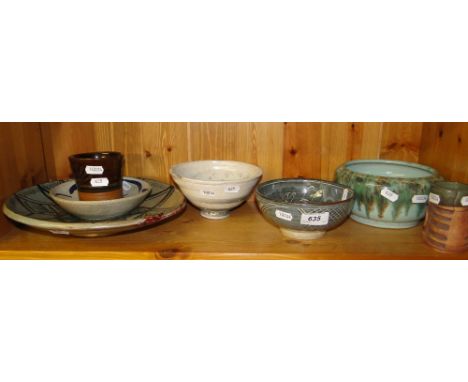 A shelf of Studio Pottery.