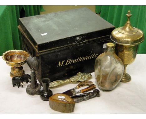 A Deed box containing nutcracker, horn handled knives in leather sheaths, brass vase, etc.